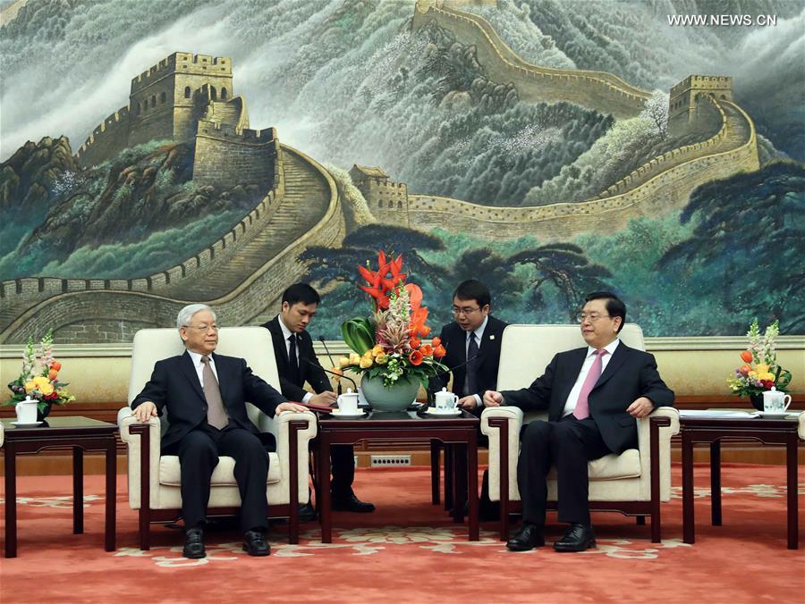 Чжан Дэцзян встретился с генеральным секретарем ЦК КПВ Нгуен Фу Чонгом 