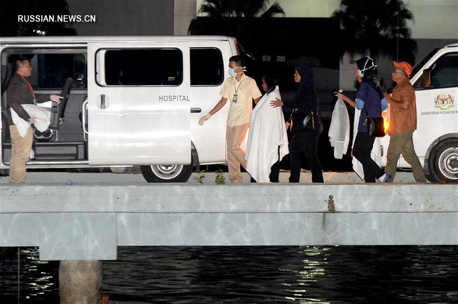 （XHDW）（2）马来西亚沙巴州沉船事件获救中国游客抵达哥打基纳巴卢 