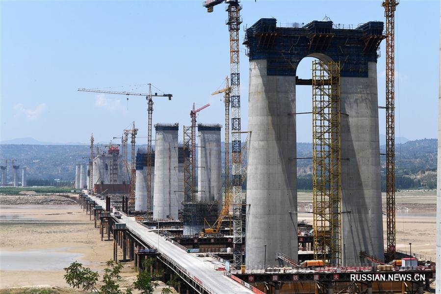 Строительство комбинированного моста в Саньмэнься
