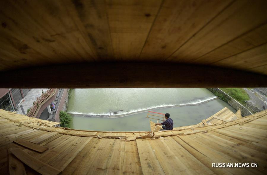 Строители "мостов дождя и ветра" из уезда Сюаньэнь