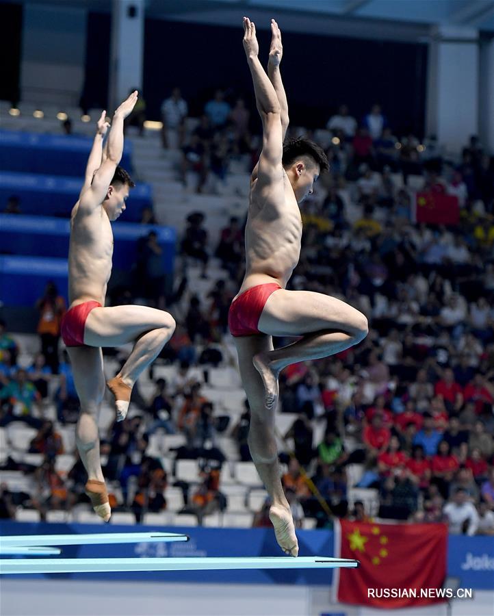 18-е Азиатские игры -- Синхронные прыжки в воду /3 м/ среди мужчин: китайские спортсмены Цао Юань и Се Сыи заняли первое место