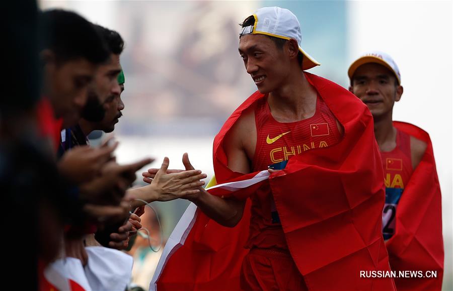 18-е Азиатские игры -- Легкая атлетика, спортивная ходьба: китайские скороходы выиграли золото и бронзу на дистанции 20 км