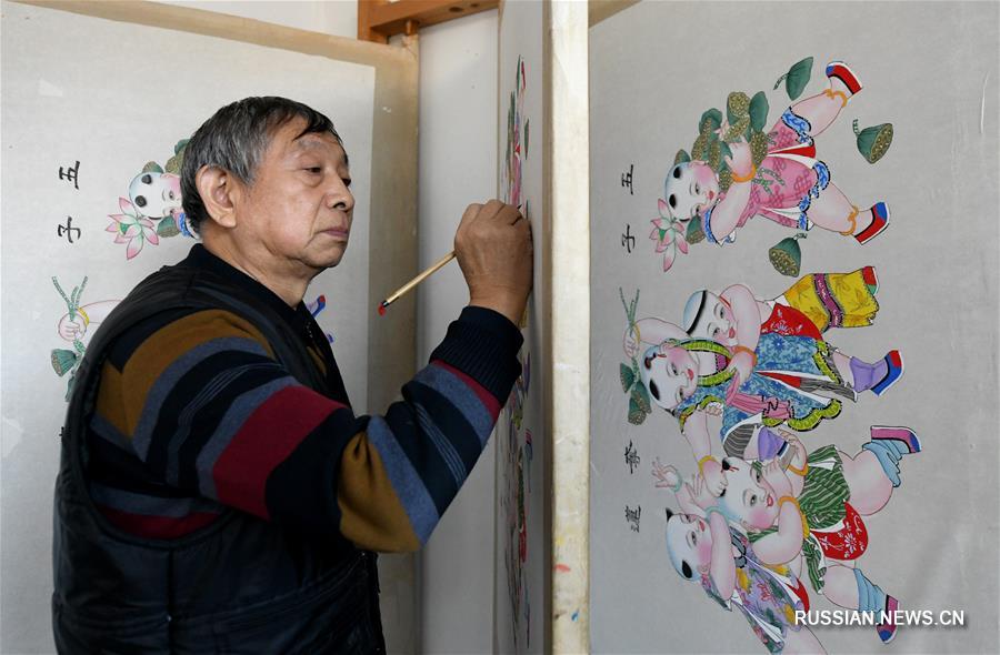 Хранитель традиции создания янлюцинских новогодних картинок Хо Циншунь 