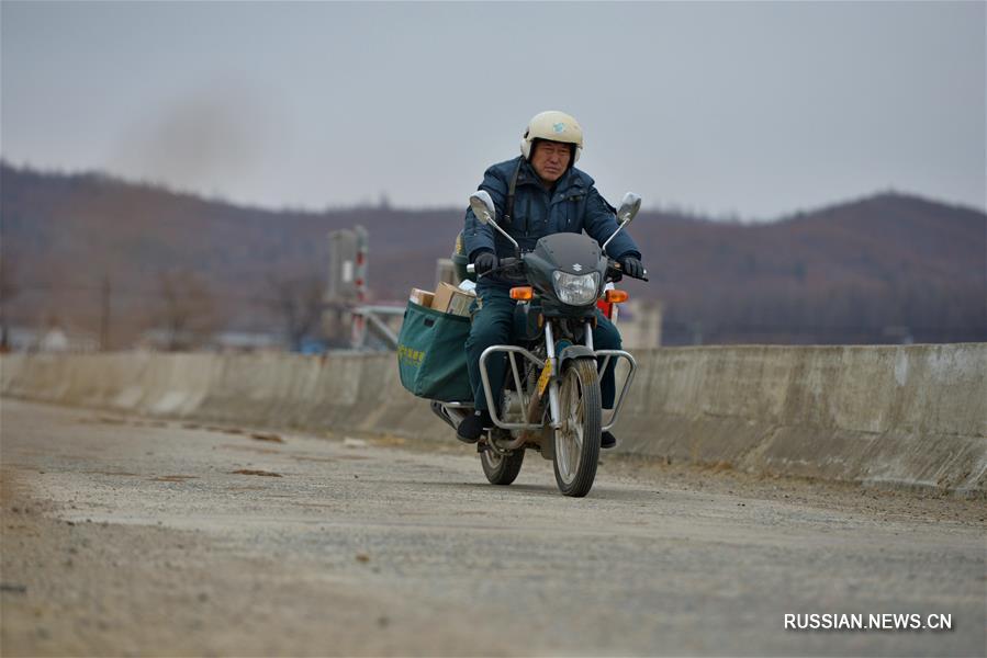 Почтальон с 30-летним стажем работы из провинции Цзилинь