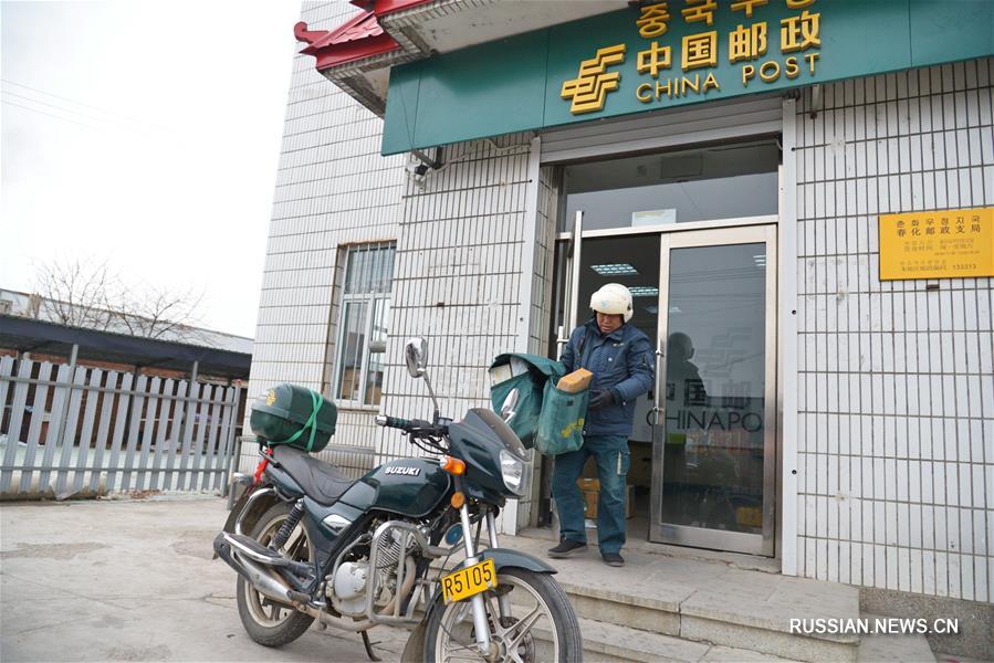 Почтальон с 30-летним стажем работы из провинции Цзилинь