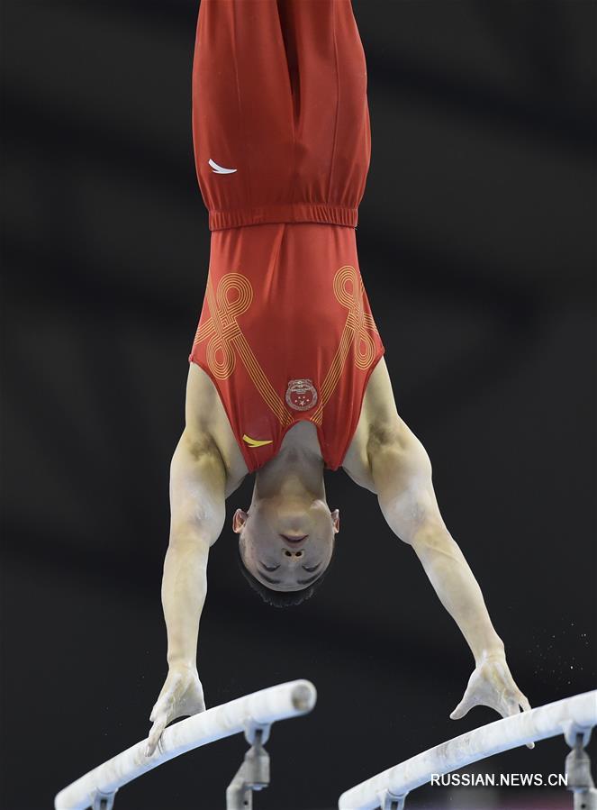 Спортивная гимнастика -- Кубок мира 2019, этап в Катаре: Цзоу Цзинъюань завовевал золото в упражнениях на брусьях