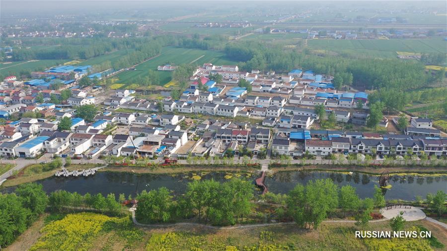 От обработки отходов к защите окружающей среде -- трансформация поселка в провинции Цзянсу