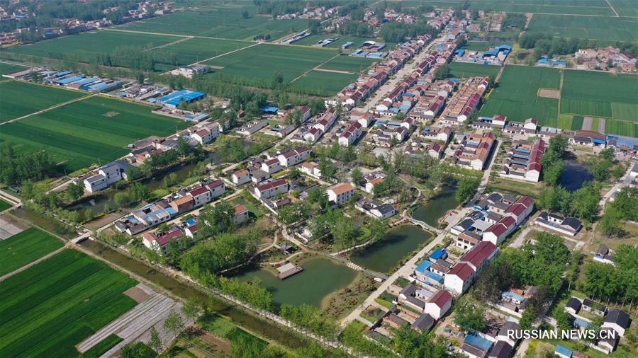 От обработки отходов к защите окружающей среде -- трансформация поселка в провинции Цзянсу