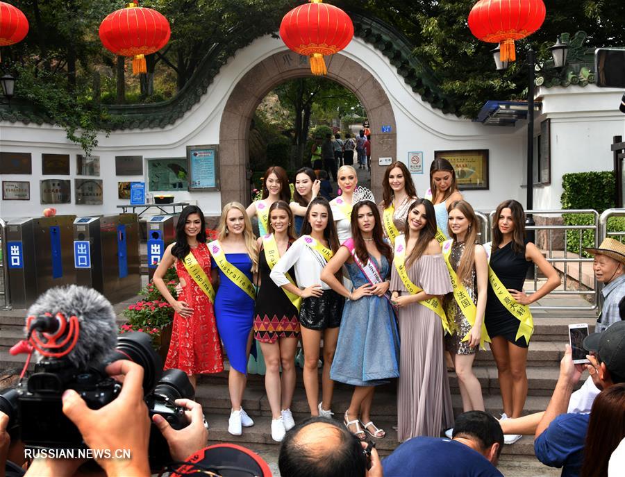 Участницы конкурса красоты "Мисс Туризм мира" 2019 на улицах Циндао