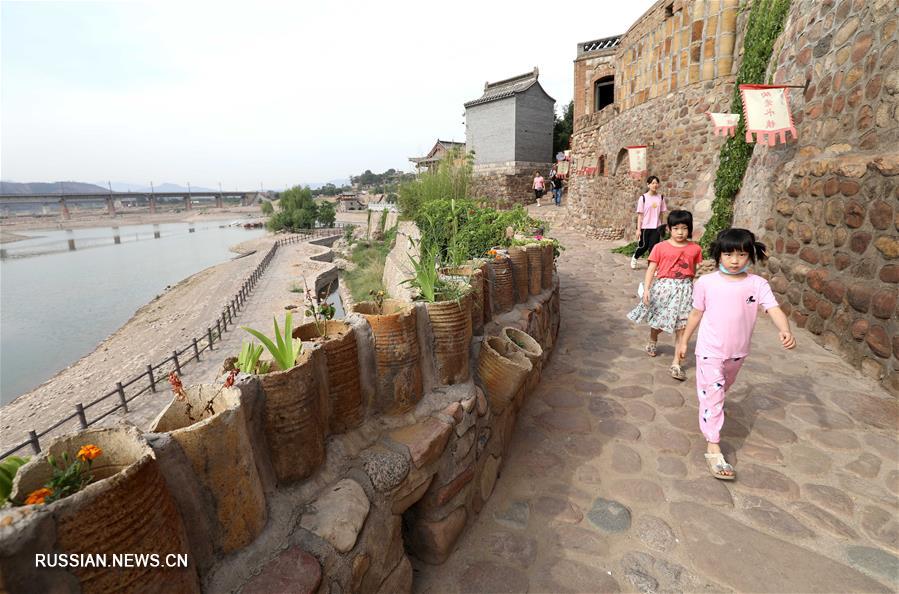 Охрана традиционных поселений и развитие сельского туризма в уезде Цзинсин