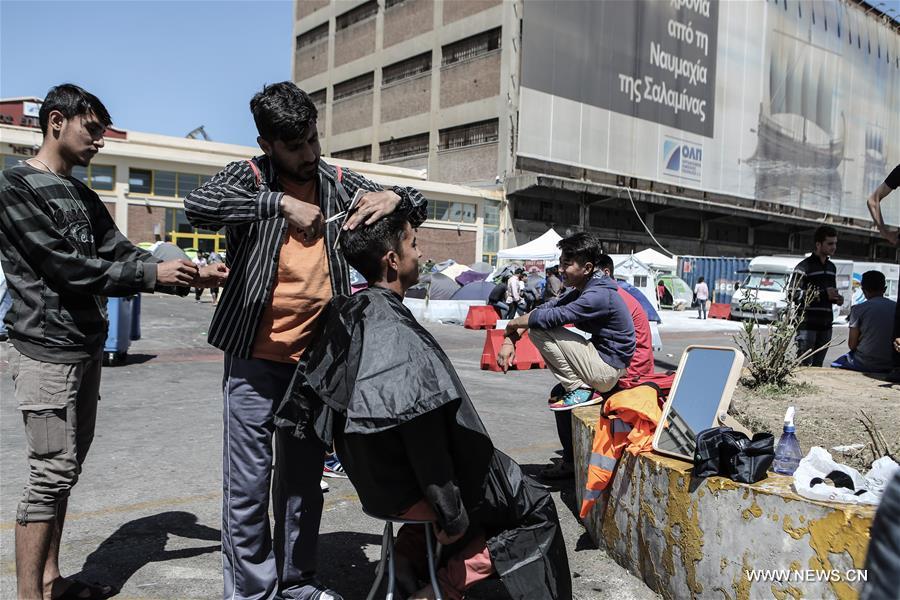 GREECE-PIRAEUS-REFUGEES-TOURISM