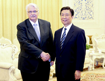Заместитель председателя КНР встретился с министром иностранных дел Польши