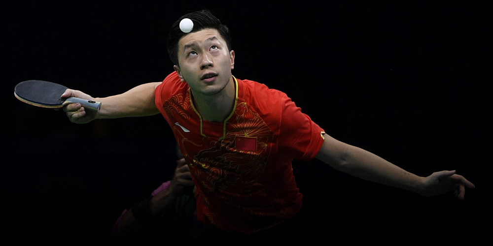 Китайские спортсмены завоевали золото Олимпиады в командном турнире по настольному 
теннису